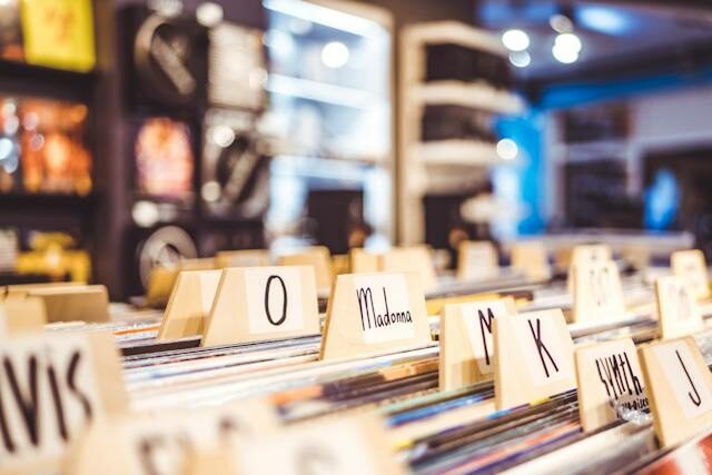Record store filing system with category dividers, representing organised document sets similar to SharePoint’s Document Set structure.